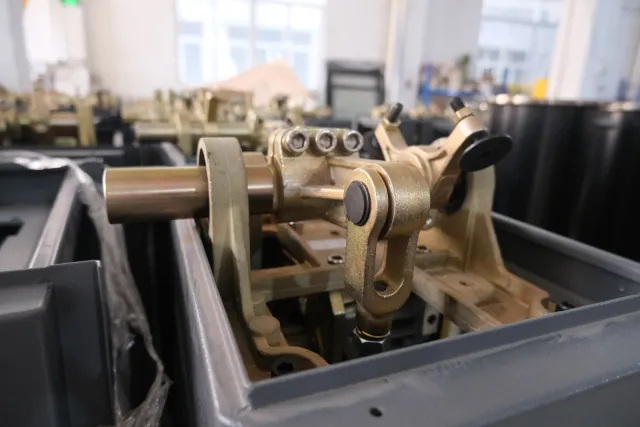 Close view of motor and gear components in the barrier gate workshop