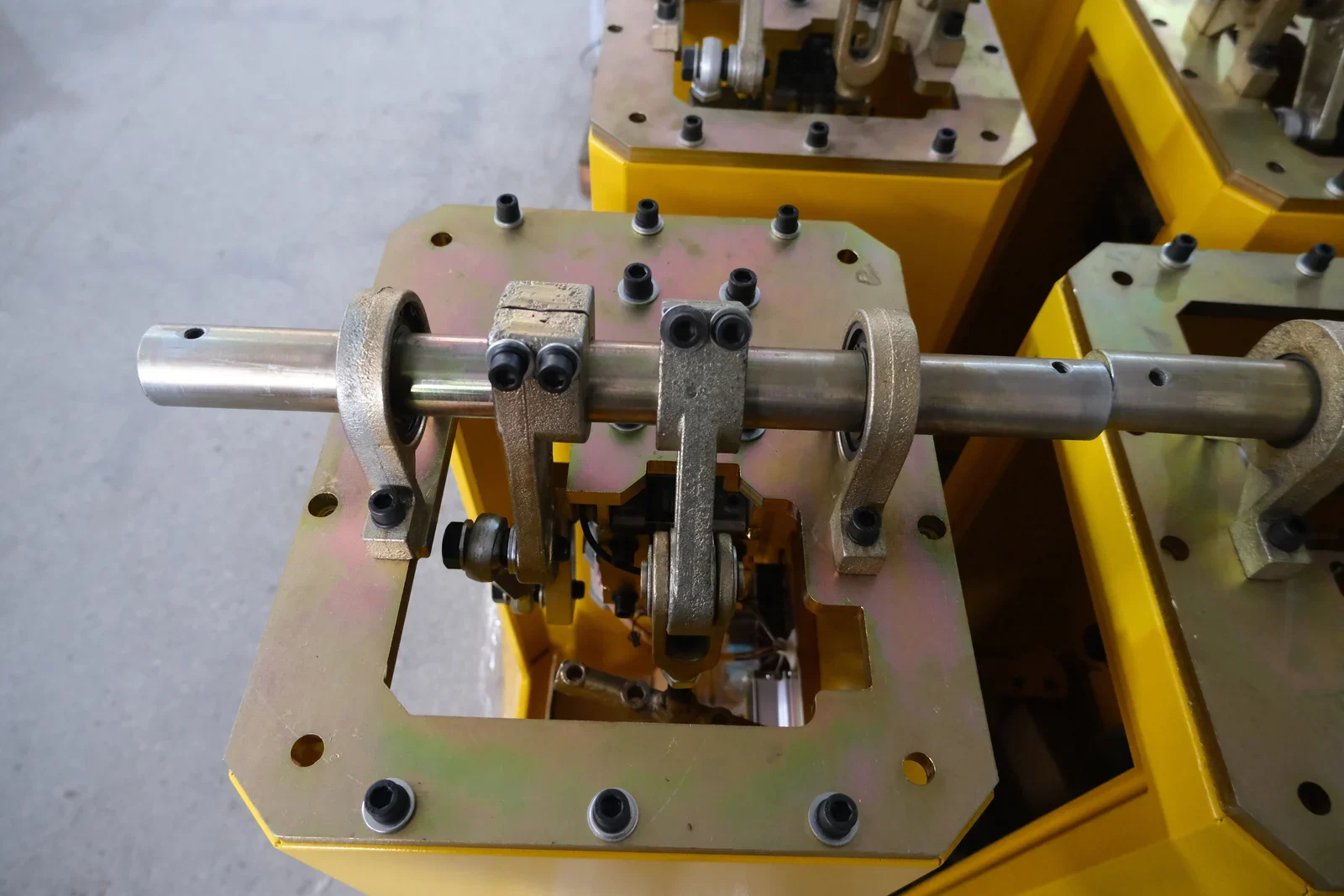 Motor and drive components assembled inside yellow barrier gate cabinets
