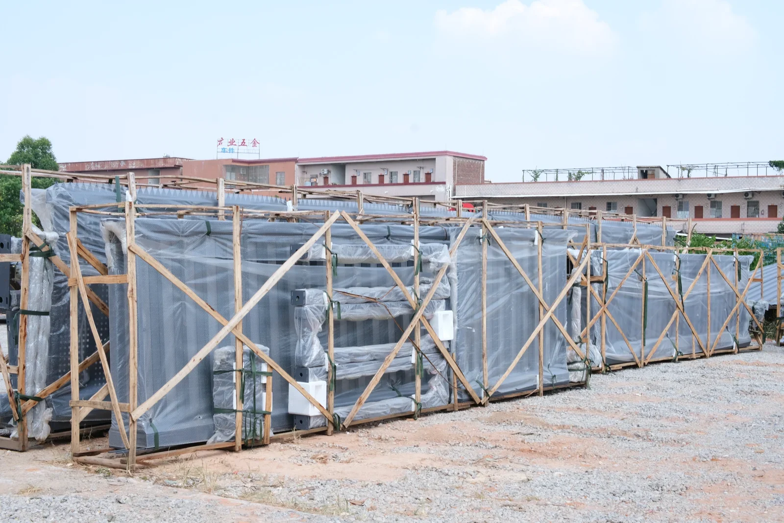 Assembled metal gate frames arranged in the yard outside the Hengbo workshop