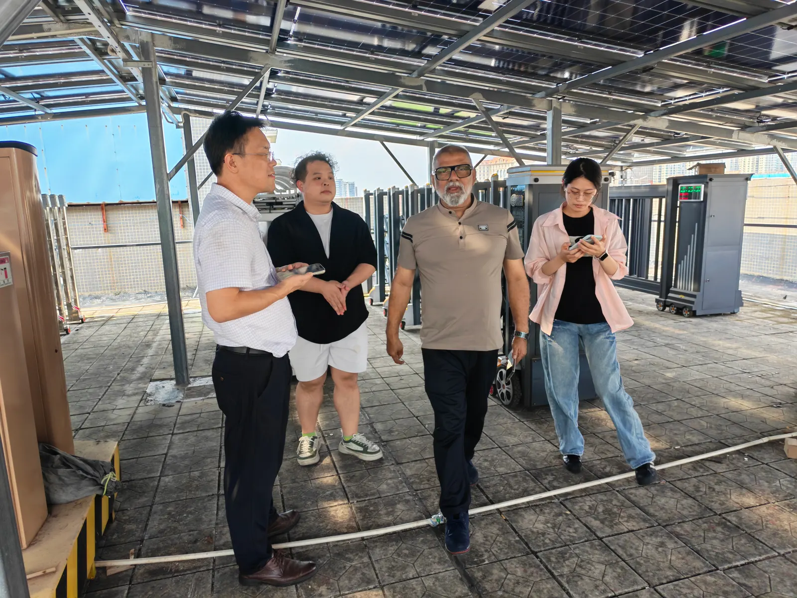 Visitors from India walking through Hengbo’s gate workshop