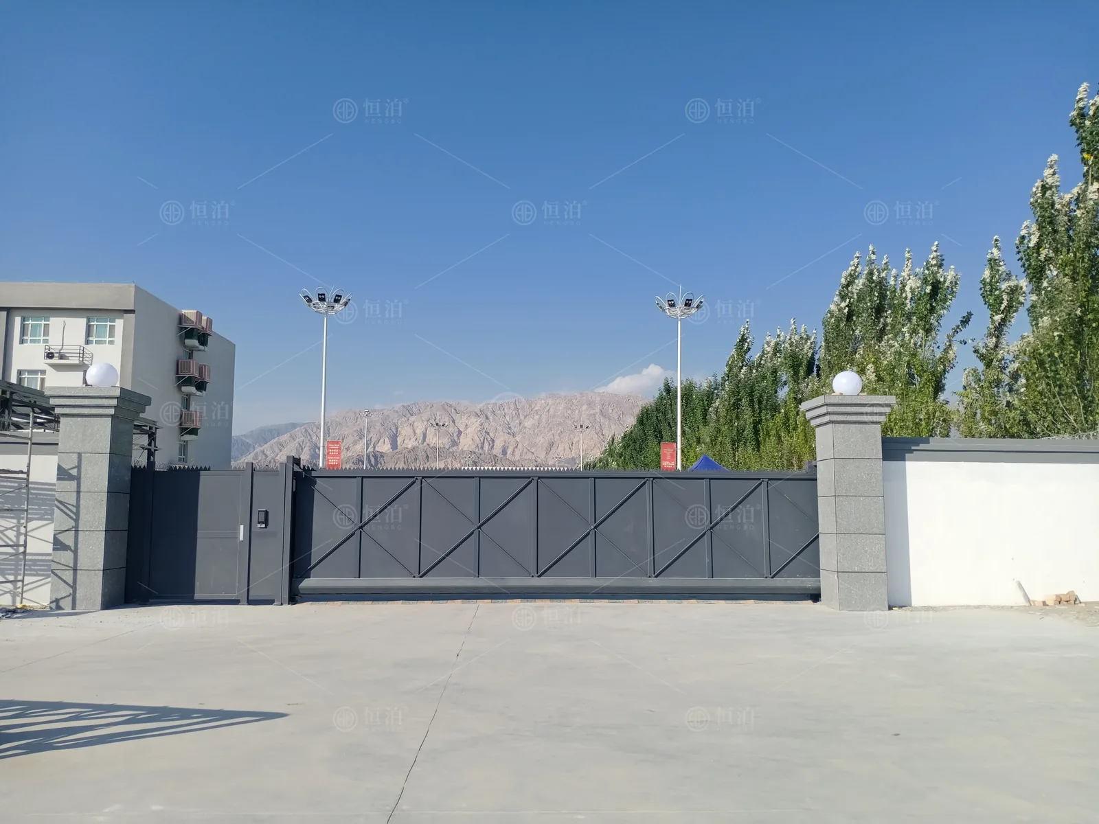 A solid-panel gate across a broad forecourt — Perth, Australia.
