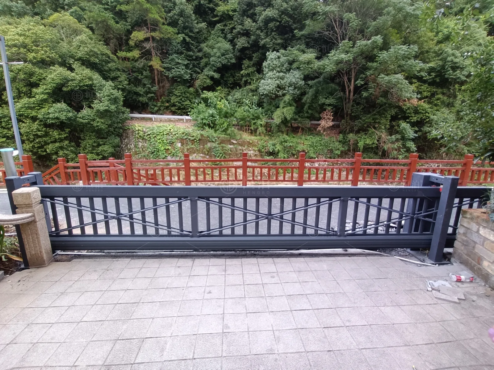 A cantilever gate on a wooded approach — Christchurch, New Zealand.
