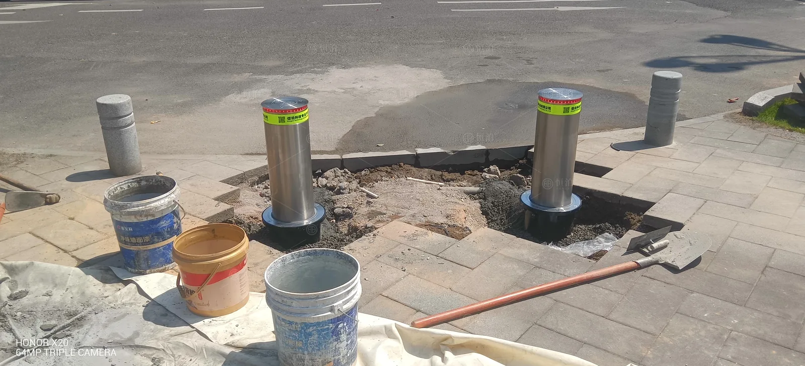 Two rising bollards at a riverside park — Krakow, Poland.
