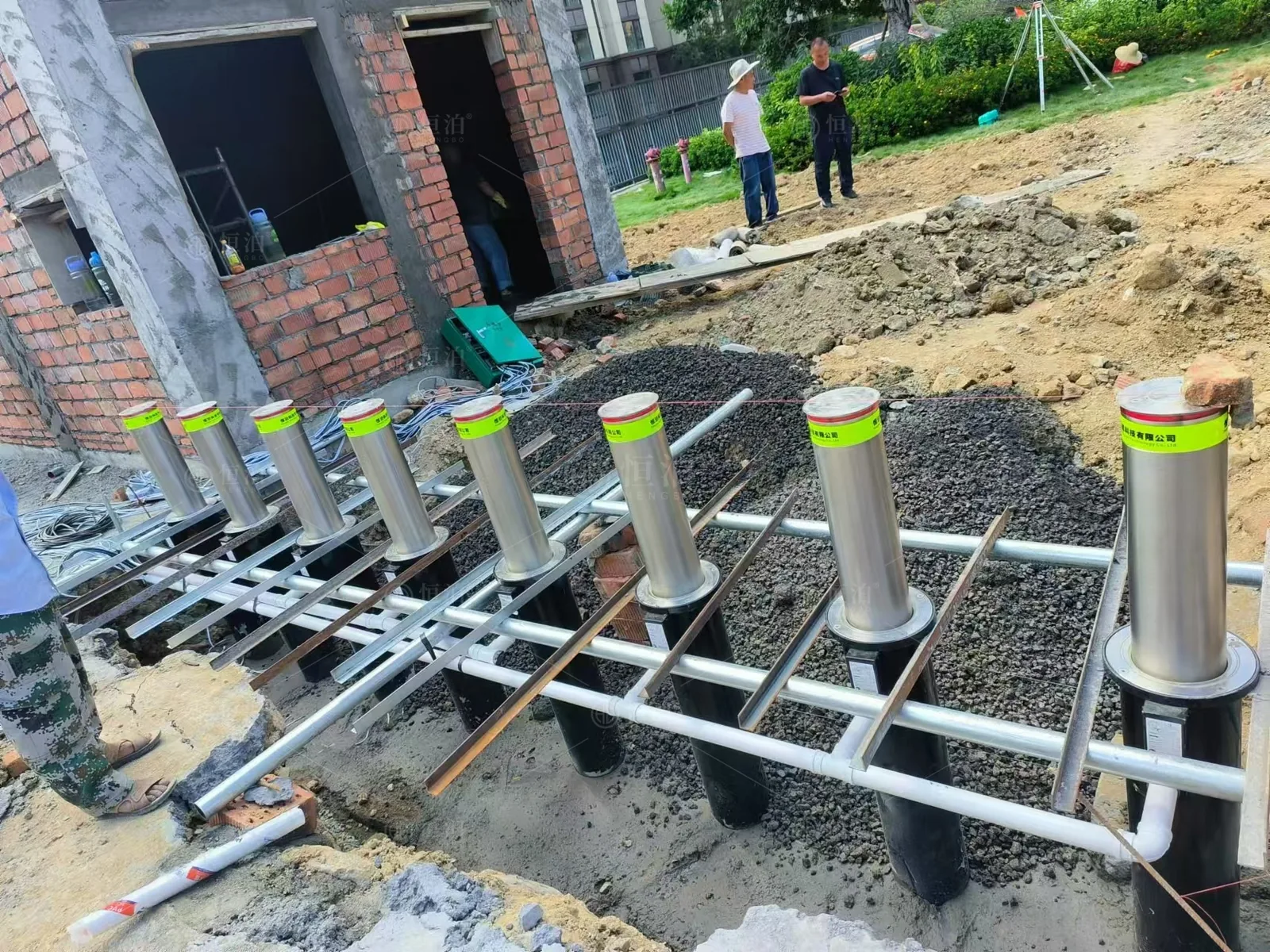 A bollard installation beneath the paving — Bangkok, Thailand.