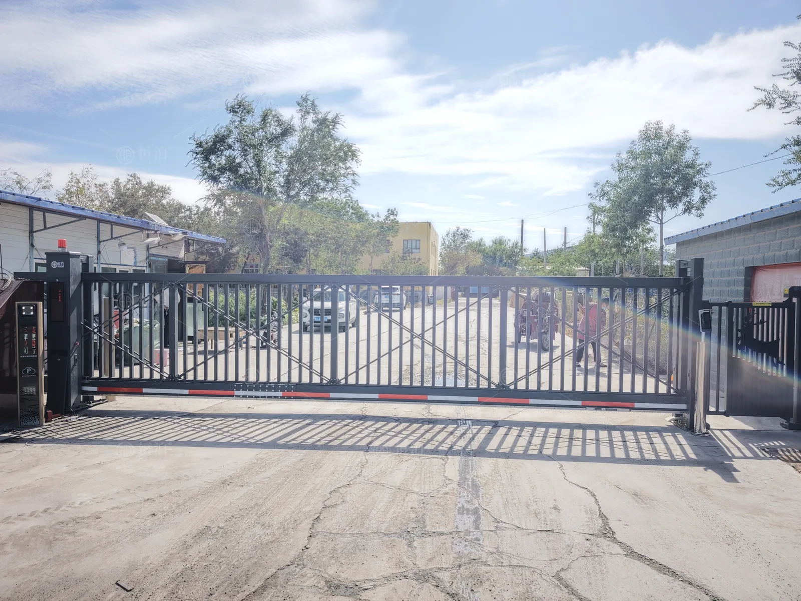 A factory gate with recognition and a side door — Dallas, United States.