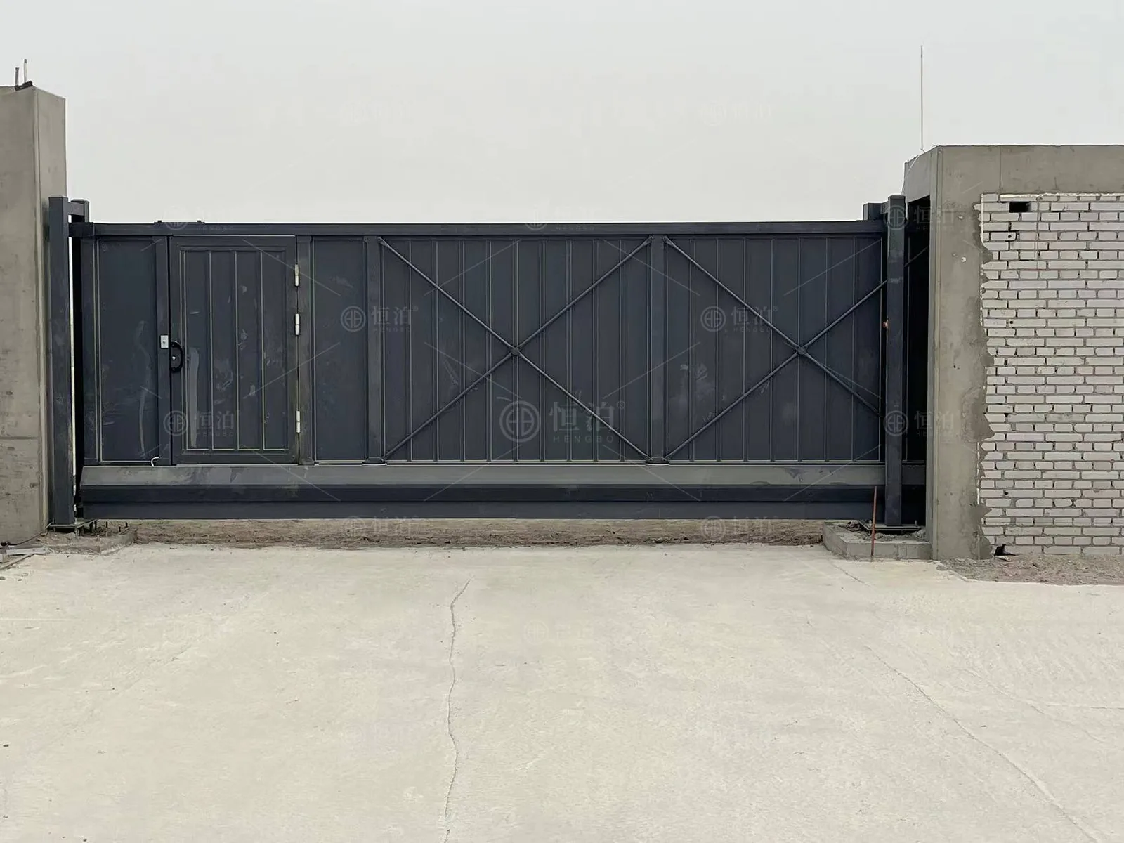 A solid-panel gate in a brick perimeter — Las Vegas, United States.