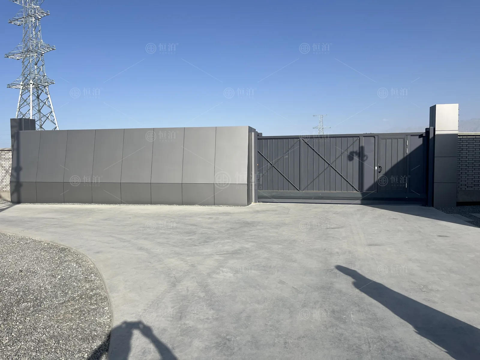 A tall screened gate with an inset door — Tucson, United States.