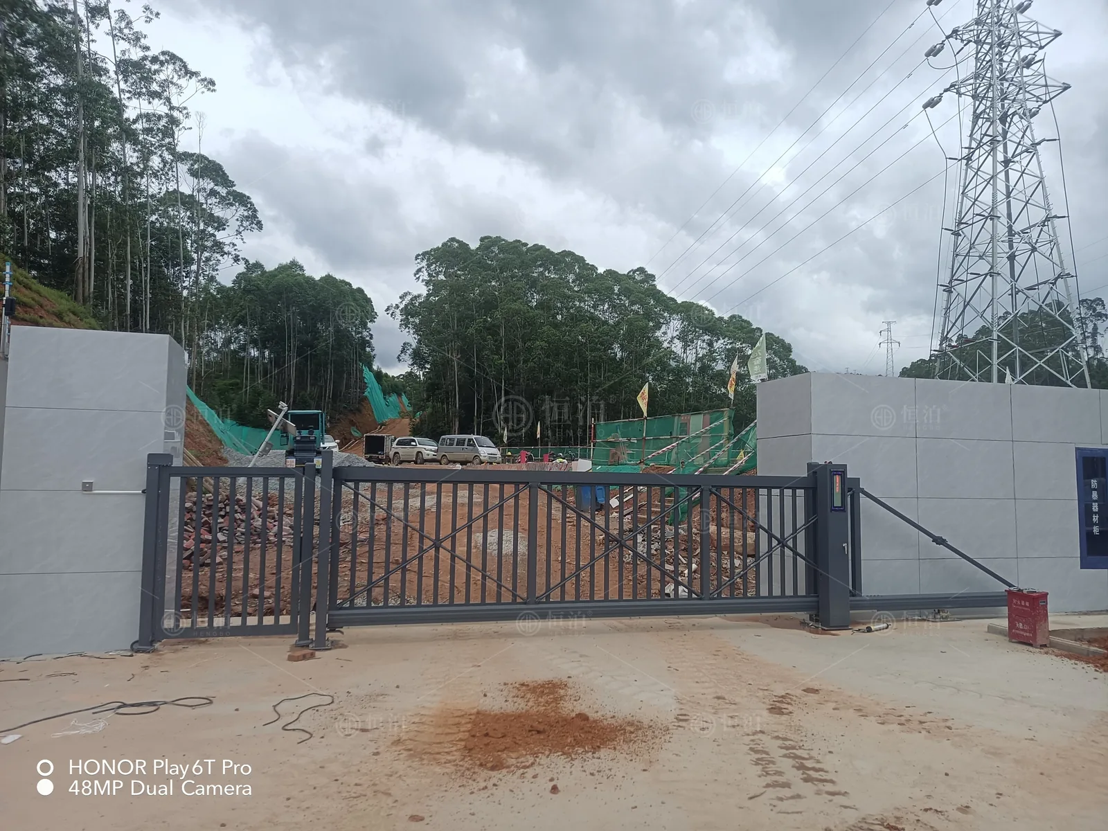 An open-bar gate at a developing energy site — Da Nang, Vietnam.
